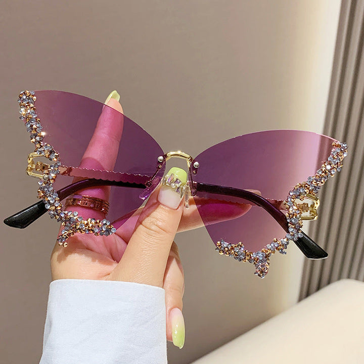 Butterfly-shaped sparkling rhinestone-rimmed sunglasses